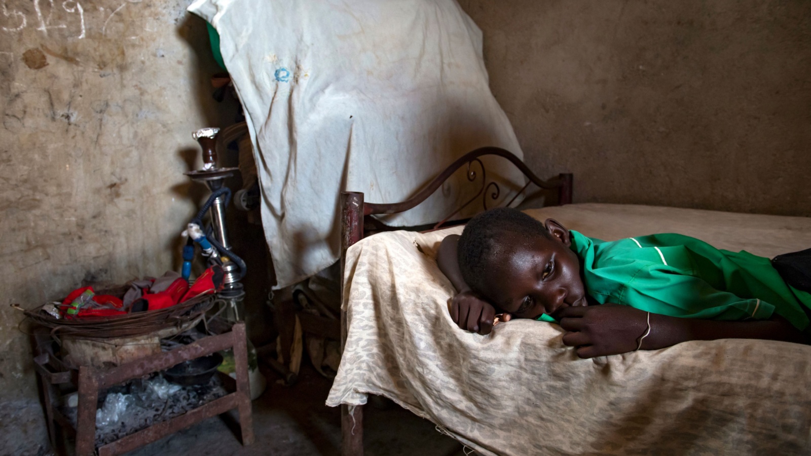 A child suffering from malaria inside his bedroom in Juba,